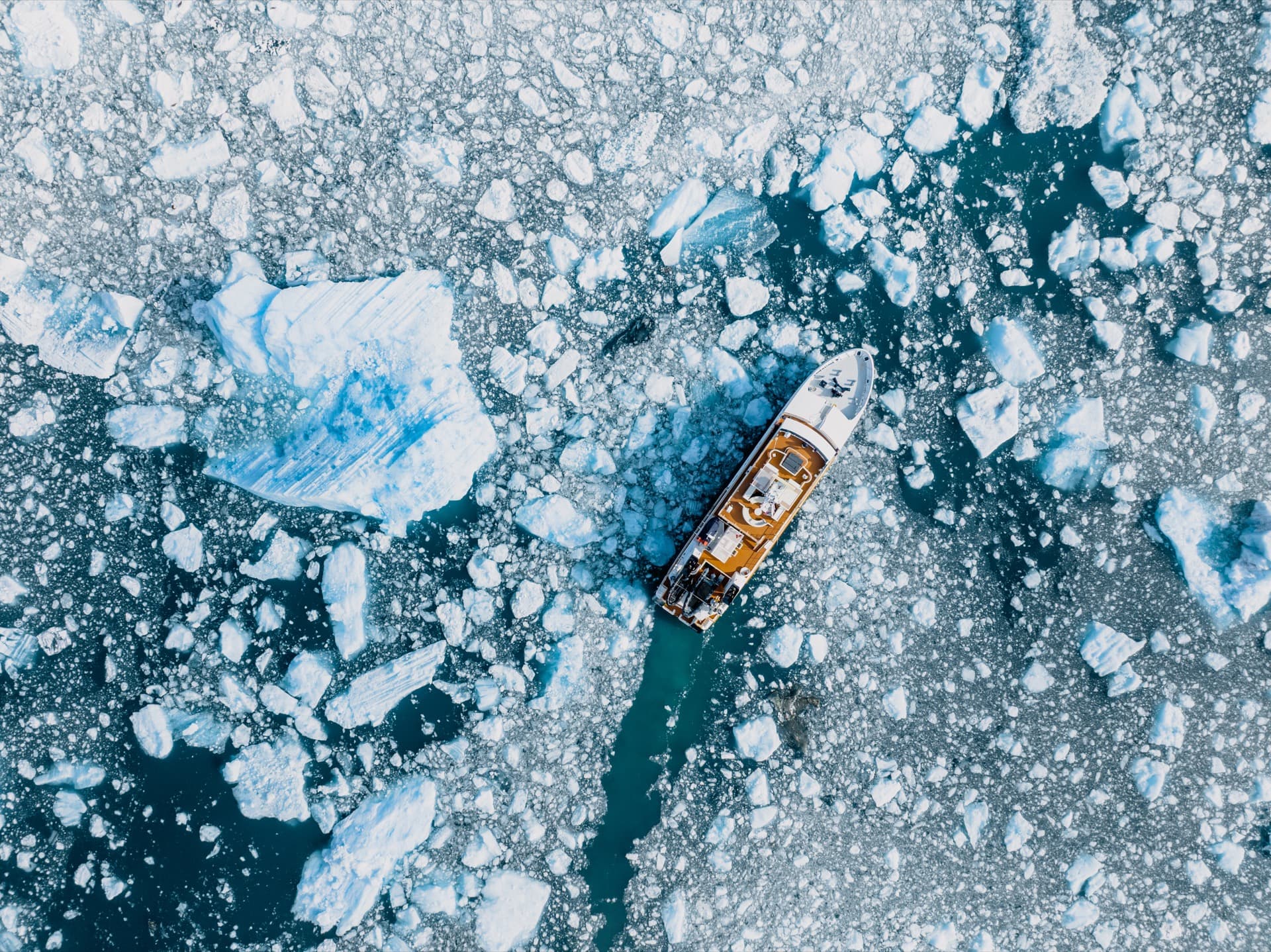 Expedition ship in sea ice, from above